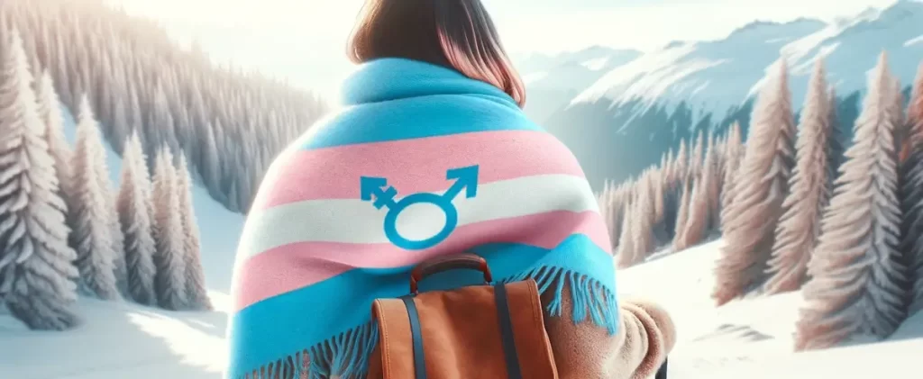 Single as a trans person during the Holiday Season - An image of a person on a solo trip, wrapped in a scarf with the colors of the transgender flag