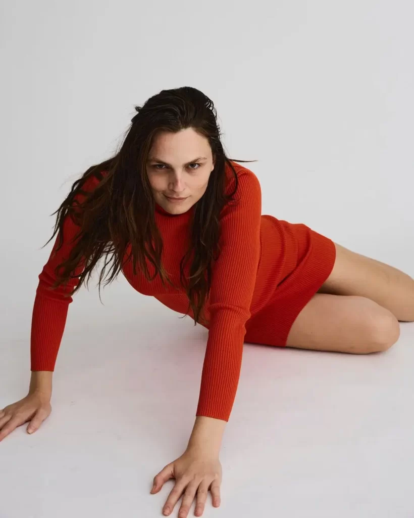 Andreja Pejić in red dress posing on white background