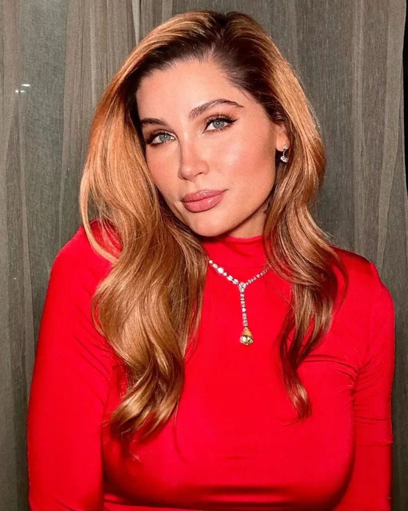 Trace Lysette in red top with necklace.